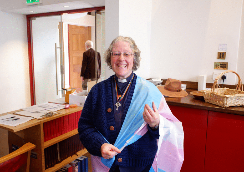 Ruth wearing a trans flag for Easter